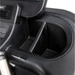 Black plastic cup holder with divider insert on treadmill console panel
