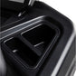 Black plastic cup holders detail on treadmill console, close-up view