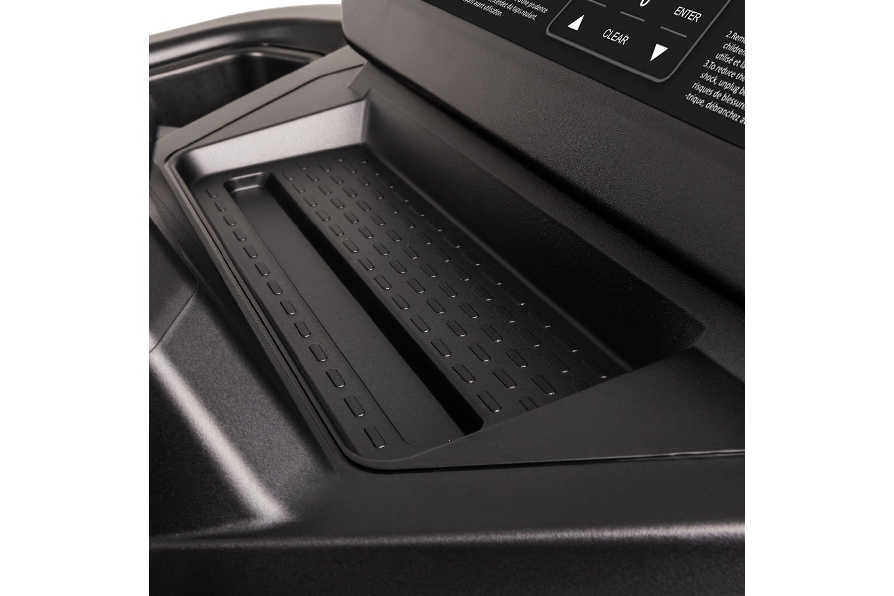 Black rubber console tray with drainage holes on Spirit CT900 treadmill