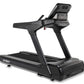 Spirit CT900 black motorized treadmill with digital display console and handrails on white background