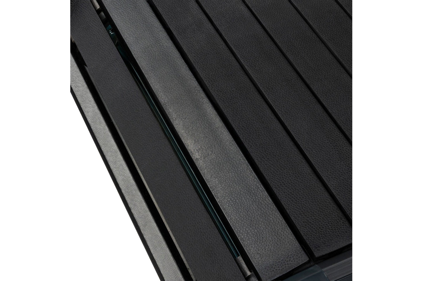 Multiple black textured belts arranged diagonally showing sled treadmill running surface detail