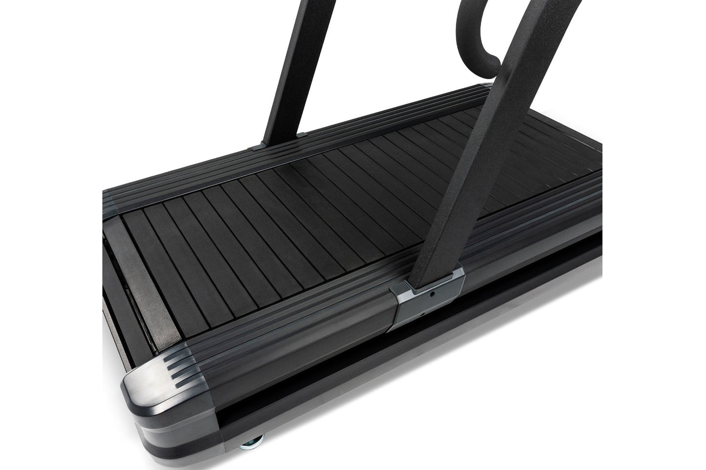 Black sled treadmill with slat belt deck, upright handles, and metal foot plate on white background