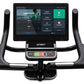 Spirit CU1000ENT upright exercise bike with black frame, curved handlebars, and Garmin touchscreen display showing workout me