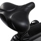 Black contoured seat with ergonomic design on stationary upright bike, close-up view