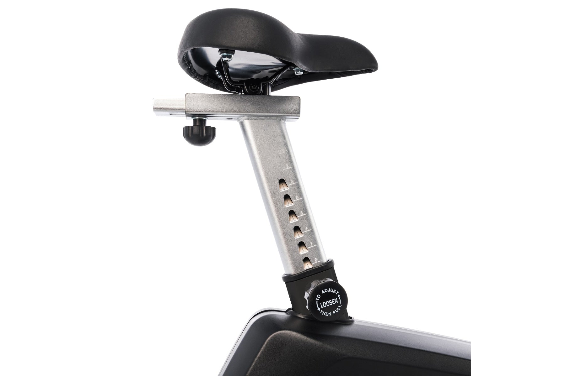 Stationary upright exercise bike with black padded seat, silver metal frame, adjustment dial, and white background
