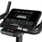 Spirit CU800 black upright exercise bike with digital display showing metrics, curved handlebars, and pedals on white backgro