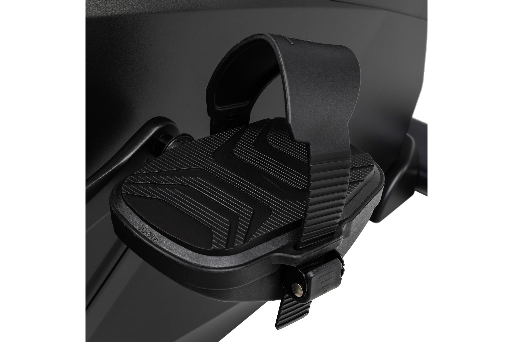 Black foot pedal with textured platform and adjustable strap on exercise bike, close-up view