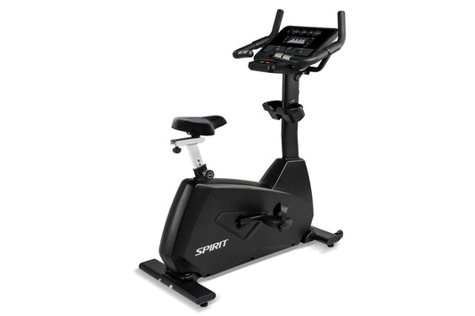 Spirit CU800 black upright stationary exercise bike with digital console, padded seat, and handlebars on white background