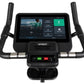 Spirit CU800ENT upright exercise bike with black frame, dual handles, digital touchscreen console displaying workout programs