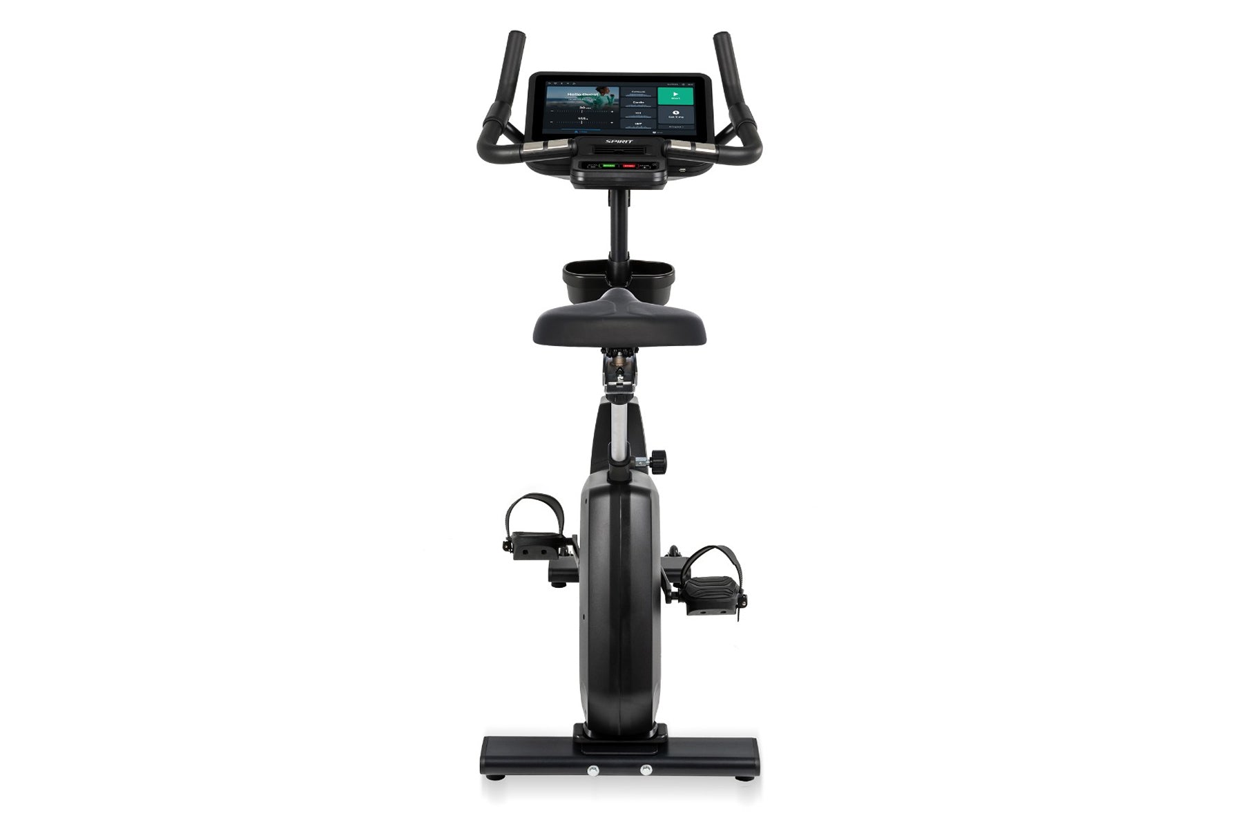 Black upright exercise bike with digital touchscreen console, dual handles, padded seat, and foot pedals with straps on white