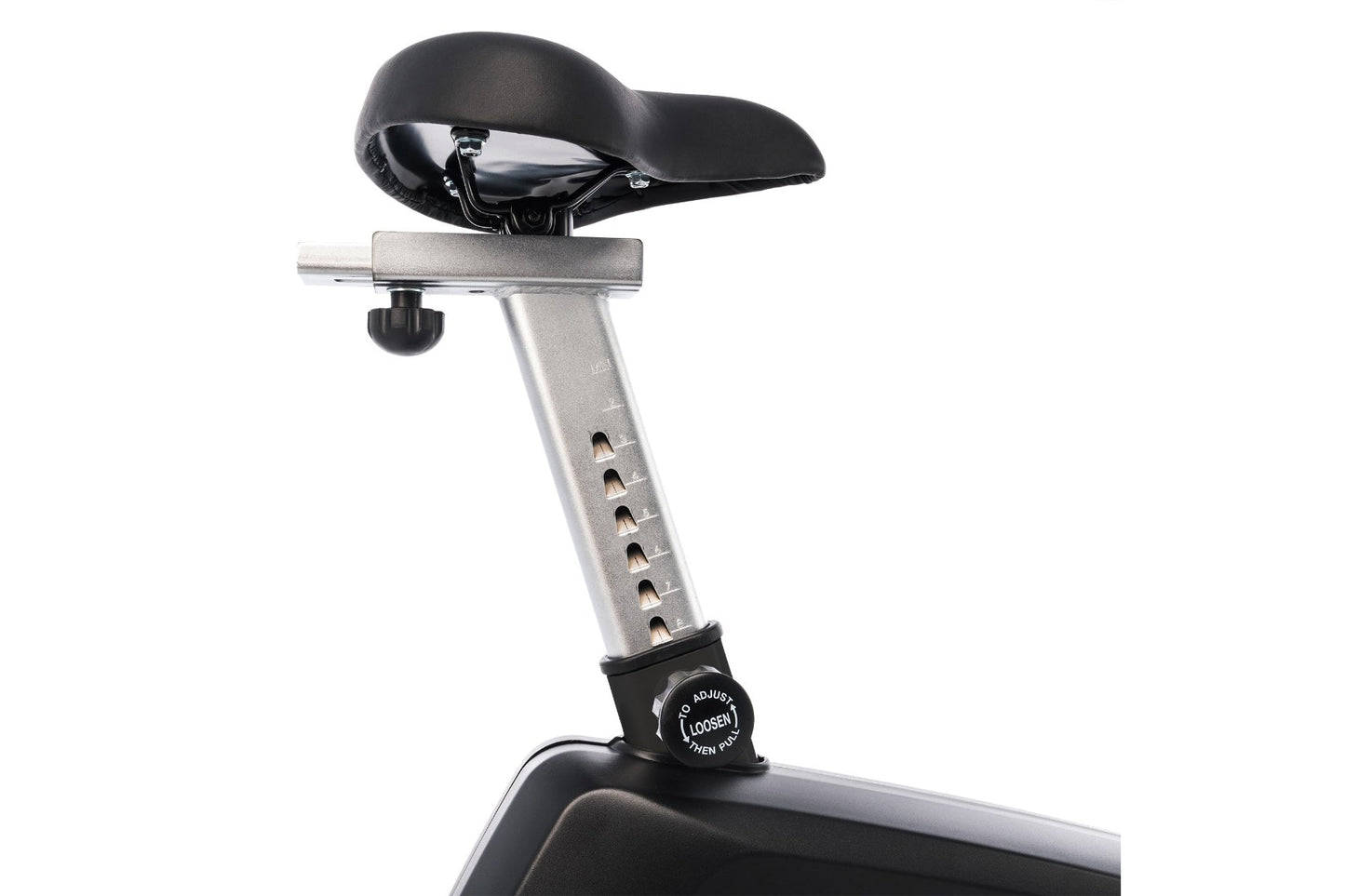 Upright exercise bike seat with black cushioning and silver metal post featuring adjustment knob, on white background