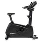 Black Spirit upright stationary bike with padded seat, adjustable handlebars, and digital console on white background