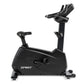 Spirit CU900 upright stationary bike with black frame, padded seat, adjustable handlebars, and foot pedals on white backgroun