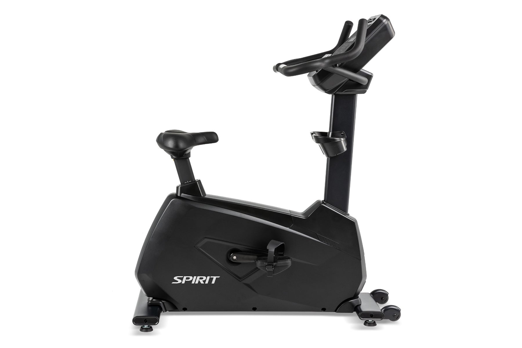 Spirit CU900 upright stationary bike with black frame, padded seat, adjustable handlebars, and foot pedals on white backgroun