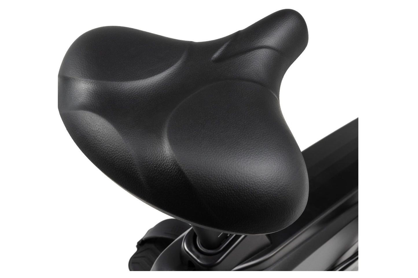 Black padded contoured seat on upright stationary bike, close-up detail view on white background