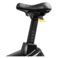 Black upright exercise bike seat with padded top, adjustable height post marked with levels 1-4, and yellow quick-release lev