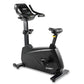 Black Spirit upright exercise bike with digital console, adjustable seat, handlebars, and pedals on white background