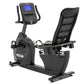 Spirit XBR25 black recumbent exercise bike with digital console, mesh-back seat, and foot pedals on white background