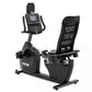 Spirit XBR55 black recumbent exercise bike with digital display console, mesh backrest, and foot pedals on white background