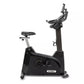 Black and gray Spirit upright stationary exercise bike with padded seat, adjustable handlebars, and digital console on white 