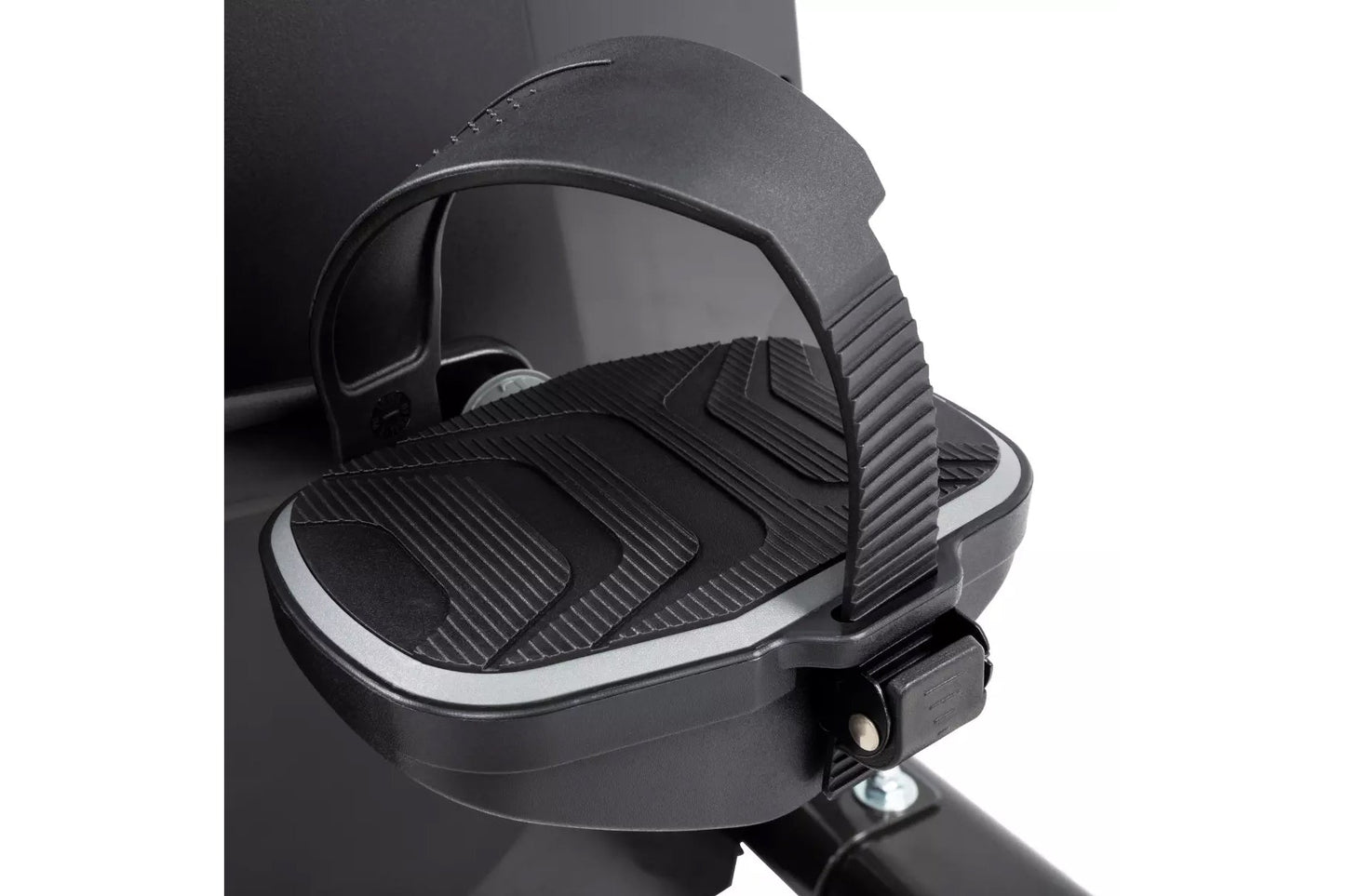 Black exercise bike pedal with ribbed platform and adjustable foot strap on white background
