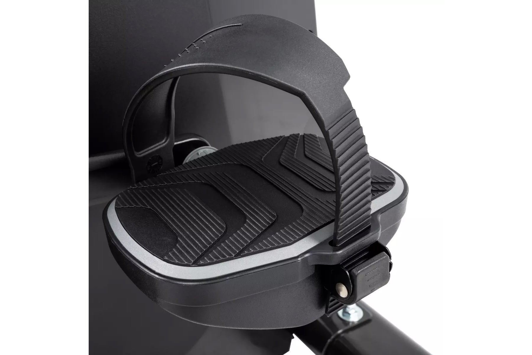 Black exercise bike pedal with ribbed platform and adjustable foot strap on white background