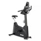 Spirit XBU55 upright stationary exercise bike with black frame, black padded seat, handlebar console display, and foot pedals