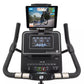 Spirit XBU55 upright exercise bike with black frame, digital display showing workout metrics, tablet mount, and dual handleba