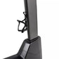 Black upright stationary exercise bike with gray seat and handlebars, shown on white background