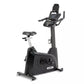 Spirit XBU55 upright exercise bike with black frame, digital console display, padded seat, and handlebars on white background