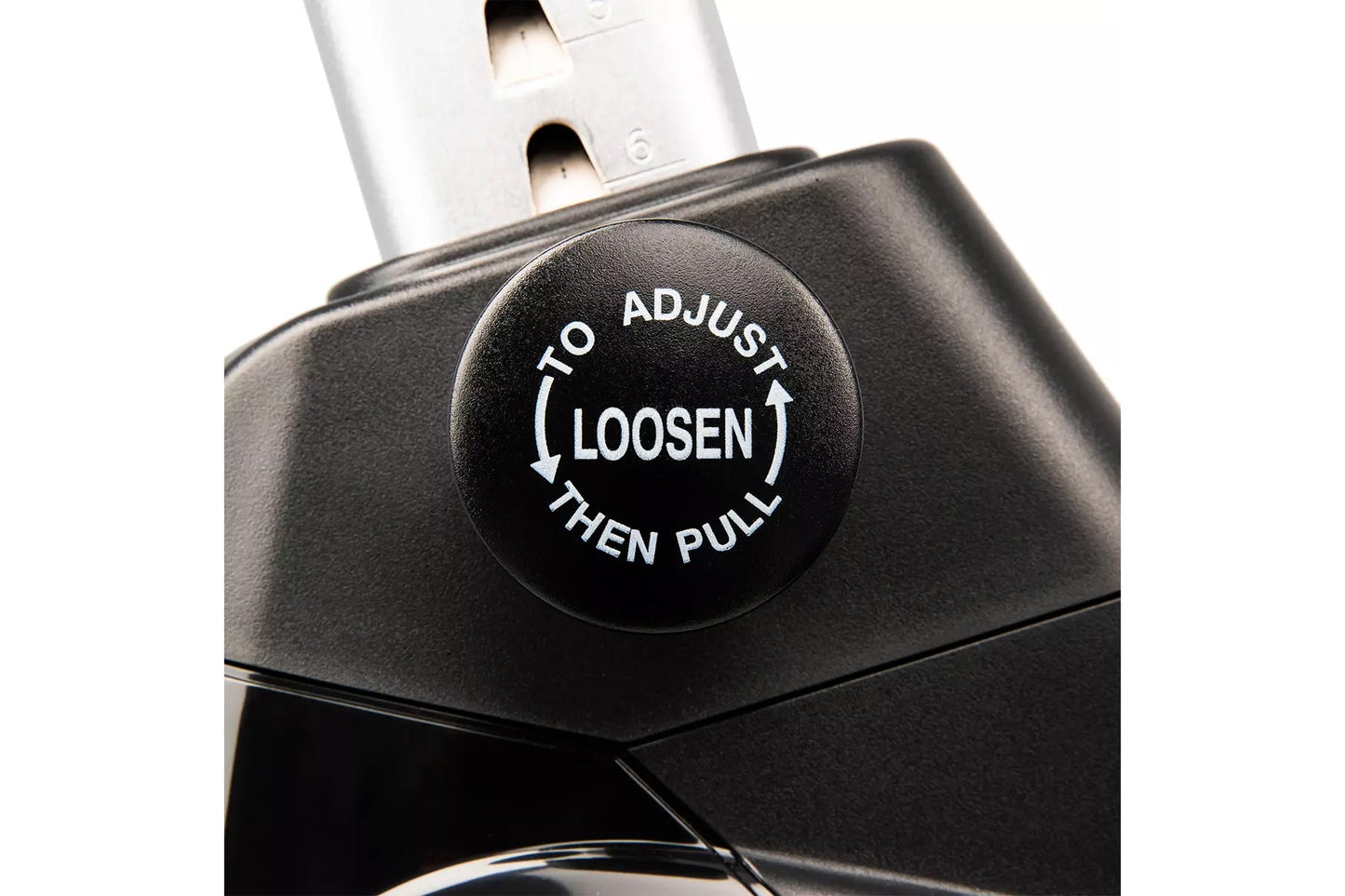 Black adjustment knob on upright exercise bike with white text reading "To Adjust Loosen Then Pull