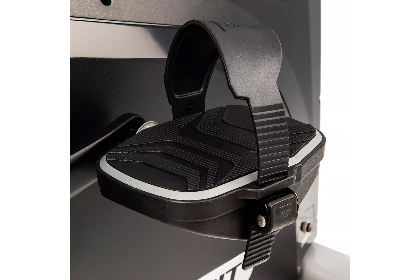 Black and gray upright exercise bike pedal with textured footplate and gray adjustable strap, displayed on white background