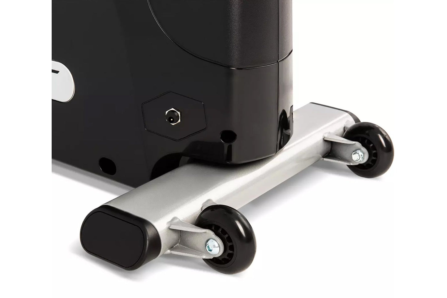 Black and silver stationary upright exercise bike with dual black wheels and metal frame, shown on white background