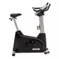 Spirit XBU55ENT upright exercise bike with black base, silver frame, black padded seat, and digital console display on white 