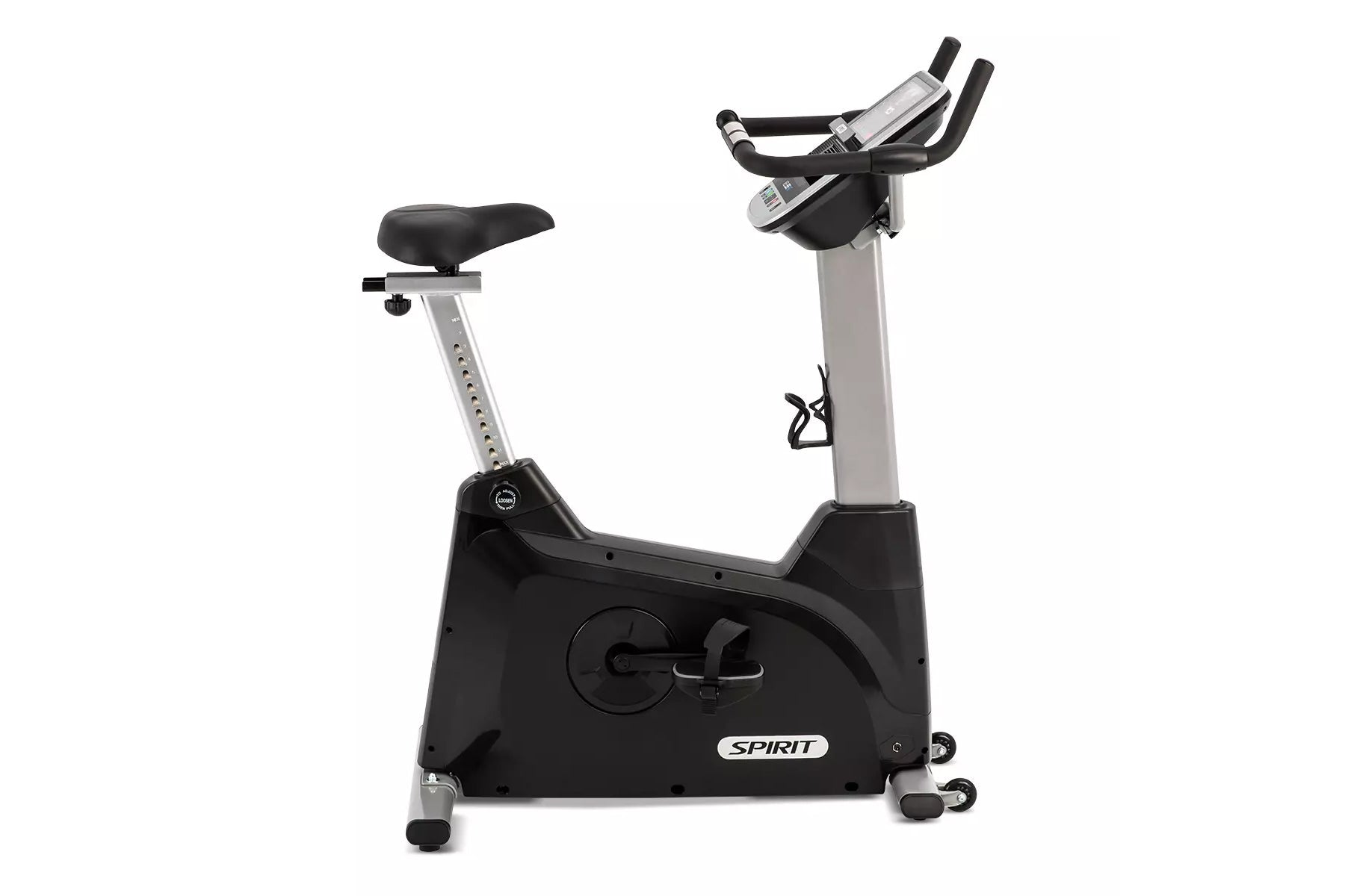 Spirit XBU55ENT upright exercise bike with black base, silver frame, black padded seat, and digital console display on white 