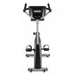 Spirit XBU55ENT upright exercise bike with black and silver frame, digital console, dual handlebars, and foot pedals on white