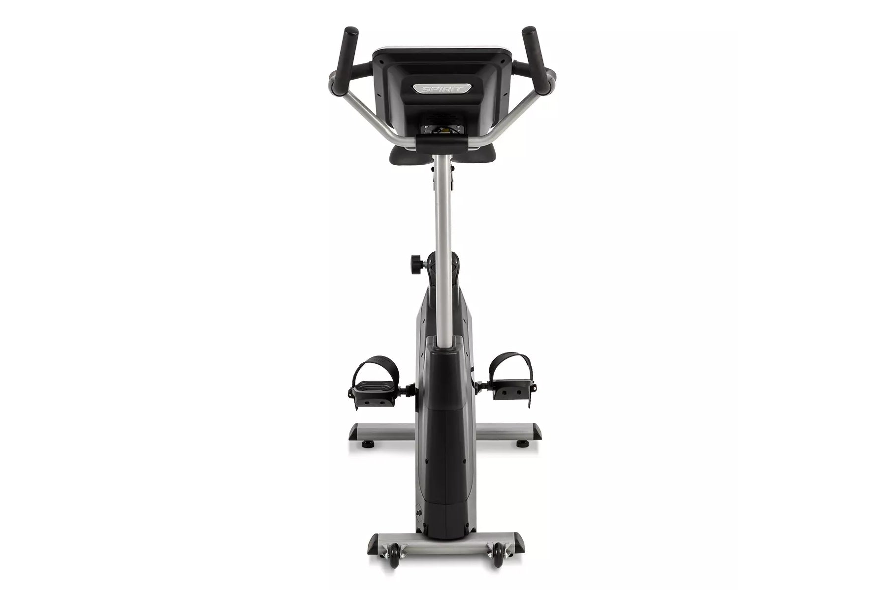 Spirit XBU55ENT upright exercise bike with black and silver frame, digital console, dual handlebars, and foot pedals on white