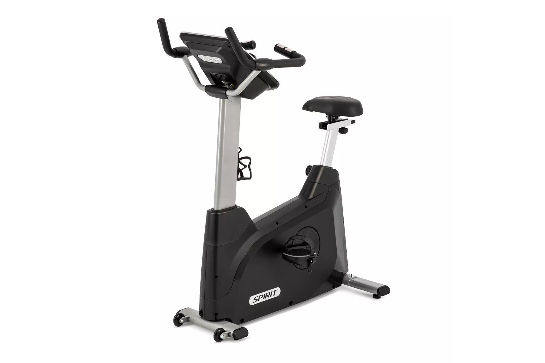 Spirit XBU55ENT upright exercise bike with black base, silver pole, black padded seat, and digital console display on white b