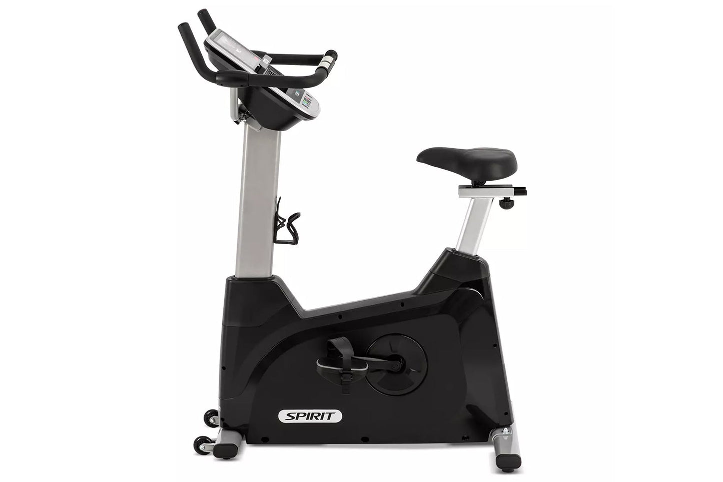 Spirit XBU55ENT upright exercise bike with black base, silver frame, padded black seat, and digital console on white backgrou