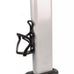 Black water bottle cage mounted on white cylindrical pole with base, front view