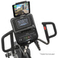 Spirit XE295 black elliptical machine with tablet holder displaying cycling game, featuring digital console with metrics disp