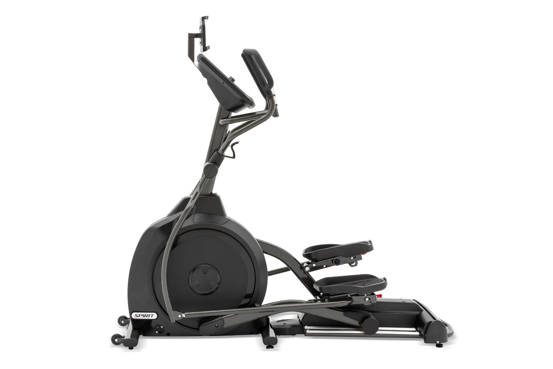 Black and gray Spirit XE395 elliptical trainer with foot pedals, padded seat, upright handles, and device holder on white bac