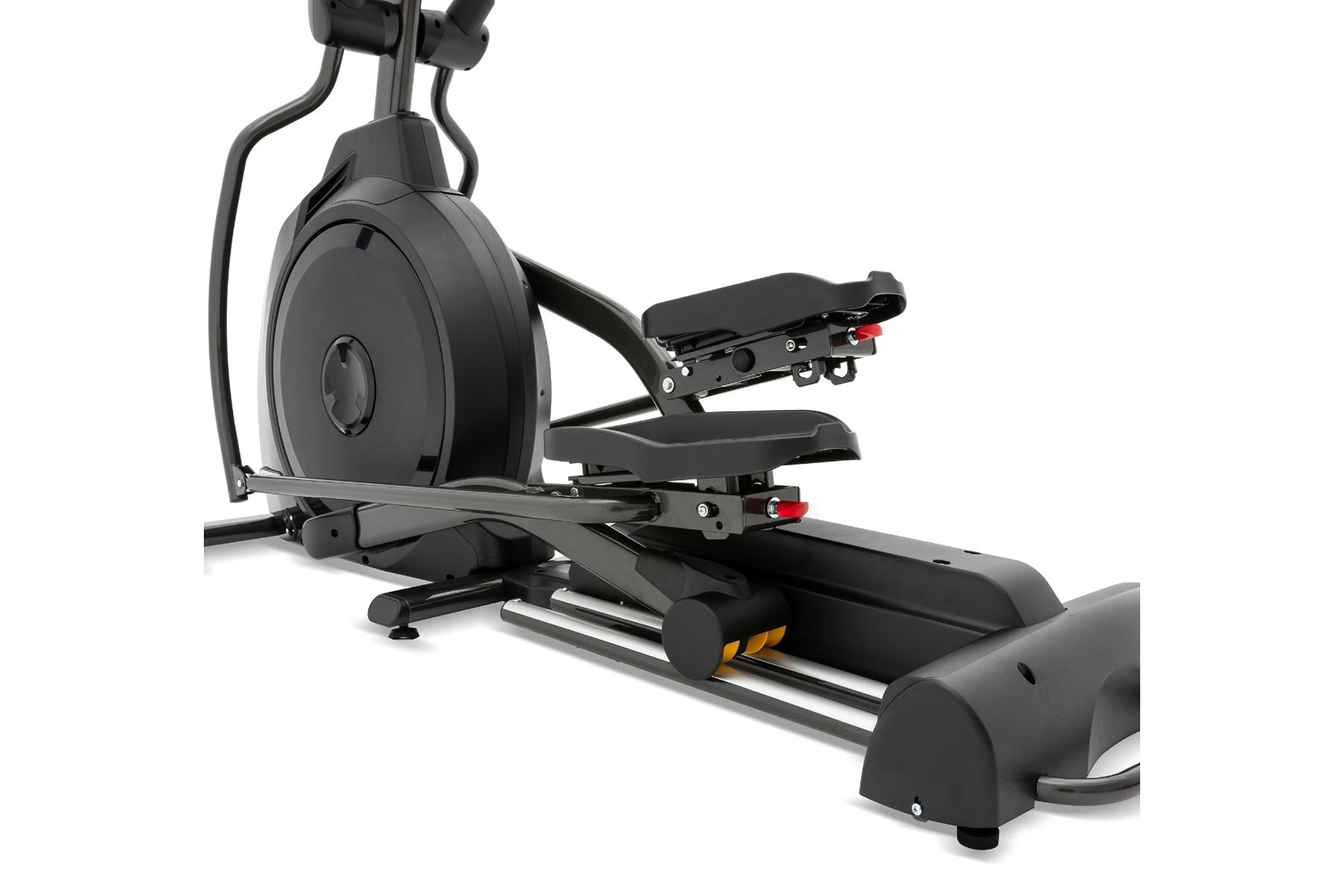 Black elliptical machine with large flywheel, adjustable footrests with red accents, and handlebars, on white background