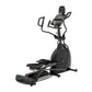 Black elliptical exercise machine with digital console display, dual handles, and footrests on white background