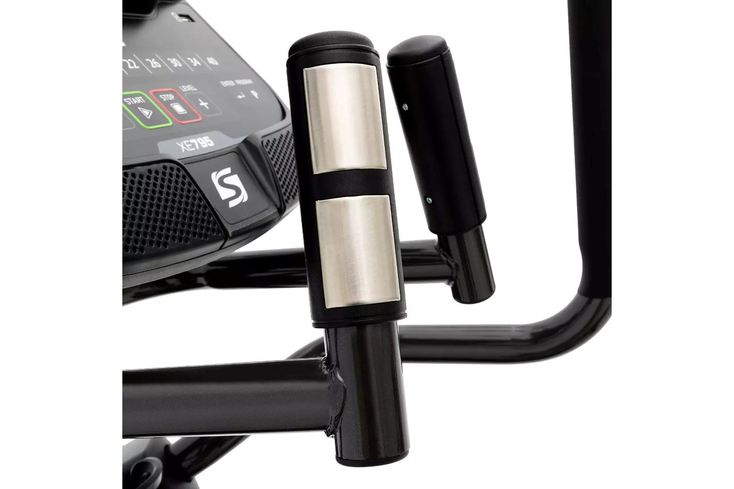 Spirit XE795 elliptical machine handlebar detail showing stainless steel and black grip with console in background