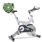 Spirit XIC600 indoor stationary bike with white frame, black seat and handlebars, featuring flywheel on white background with