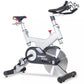 Spirit XIC600 indoor stationary bike with white frame, black and silver flywheel, red seat and handlebars, displayed against 