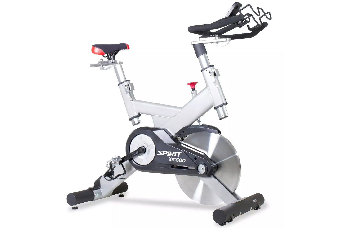 Spirit XIC600 indoor stationary bike with white frame, black and silver flywheel, red seat and handlebars, displayed against 