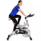 Woman wearing blue short-sleeve top and black leggings on Spirit XIC600 stationary exercise bike with gray frame and black fl