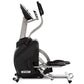 Spirit XS895 upright elliptical stepper trainer with black pedals and handles, silver frame, on white background